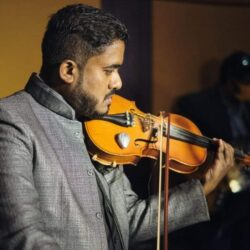 https://www.rainbowbridge.co/wp-content/uploads/2024/12/Adrew-violin-faculty-rainbowbridge-bangalore-1.jpeg